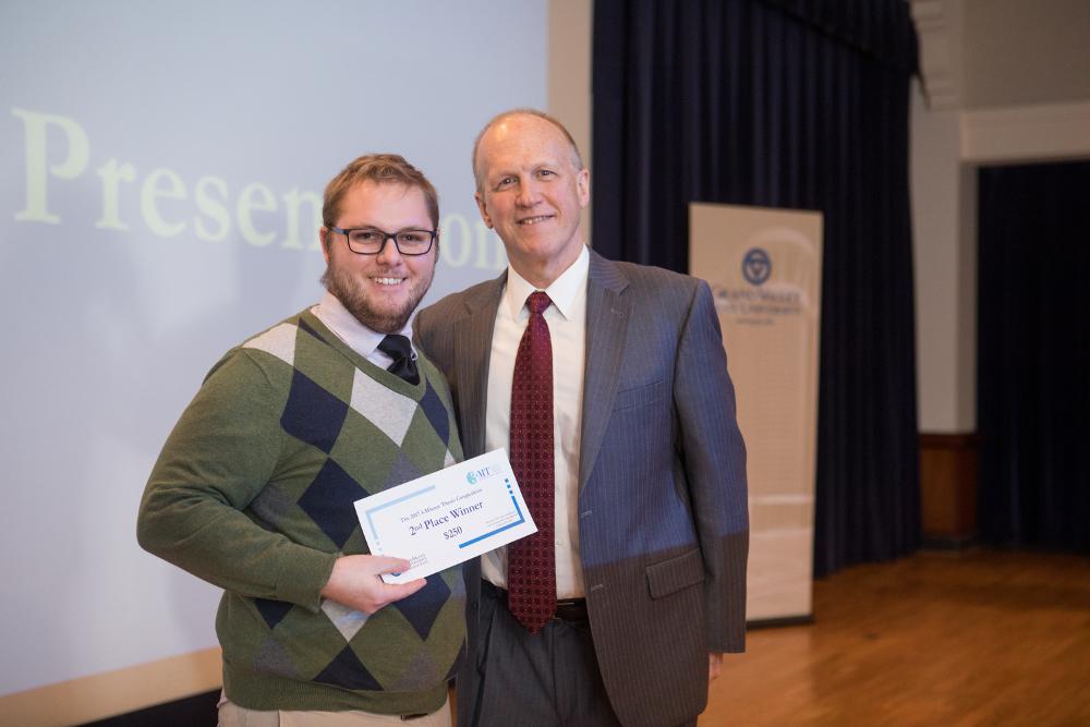 3MT Second Place winner Christopher Timmer with the Dean of the Graduate School